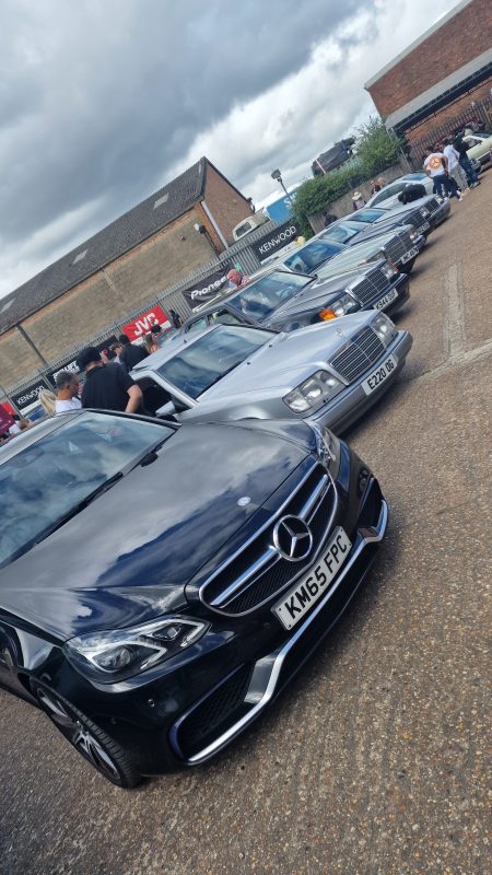 Angled photo of Mercedes-Benz cars in a yard.