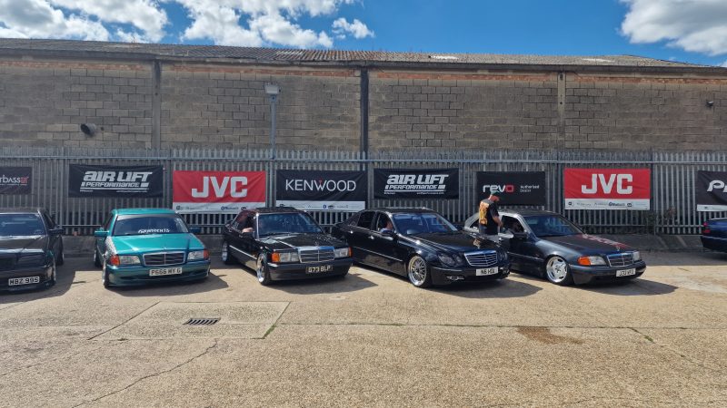 Row of Mercedes-Benz cars in front of the CAS showroom.